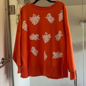 Orange Sweater with Ghost Pattern size is small but a VERY large small.